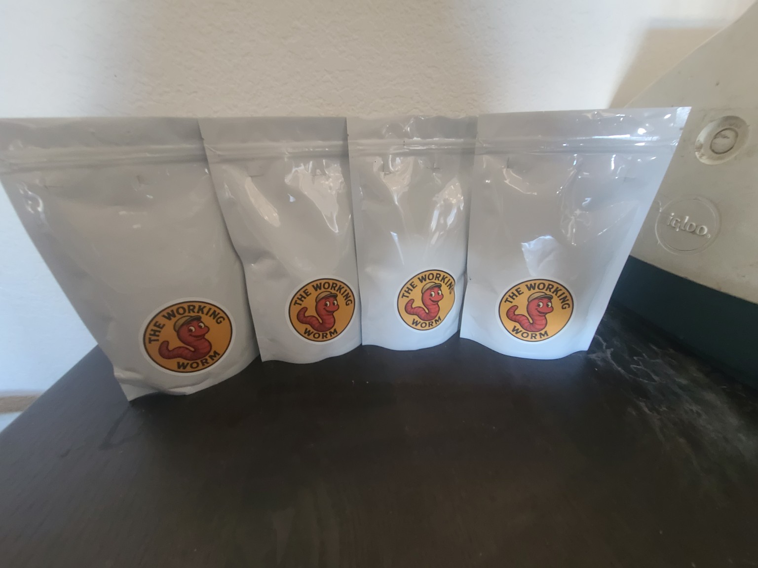 Four bags of The Working Worm castings with original logo labels